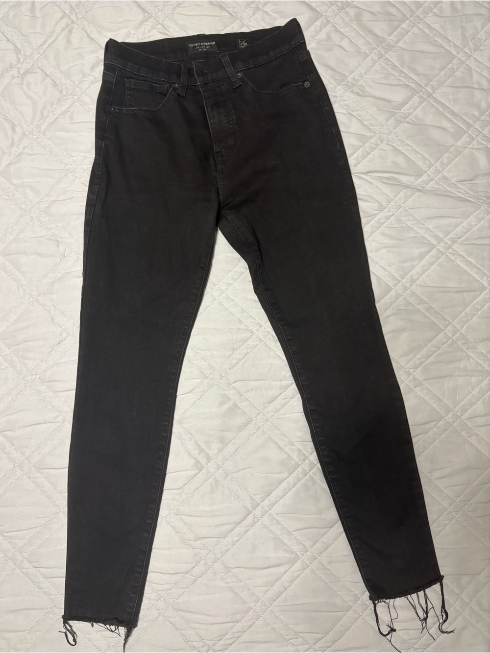 Lucky Brand women’s High rise Black Skinny Jeans with Frayed Hem